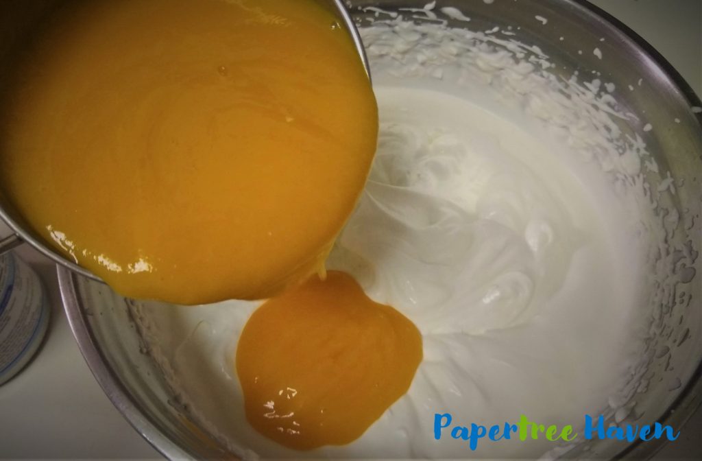 add mango puree to whipped cream for making mango ice cream